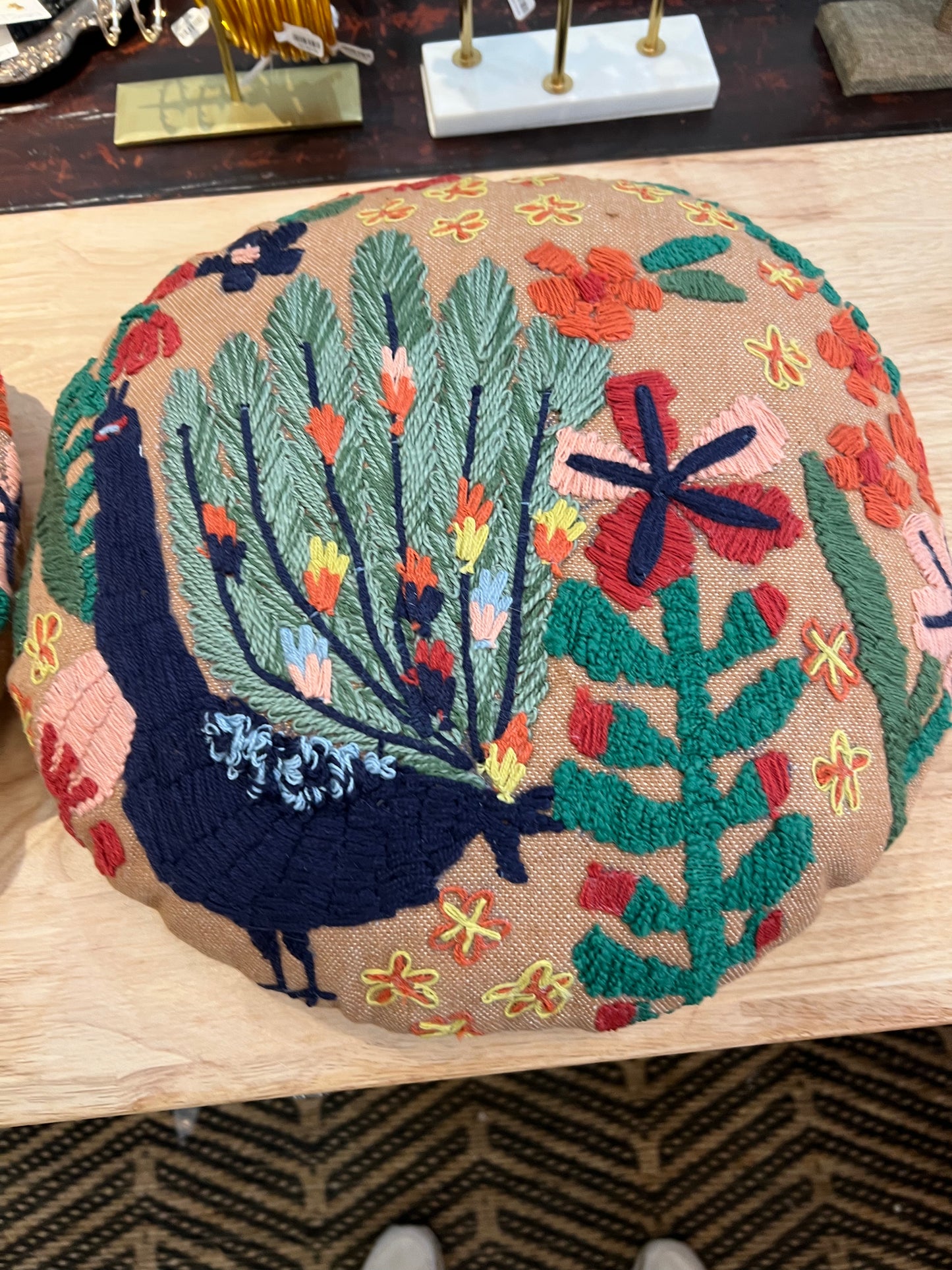 Indoor/outdoor pillow with peacock and flowers