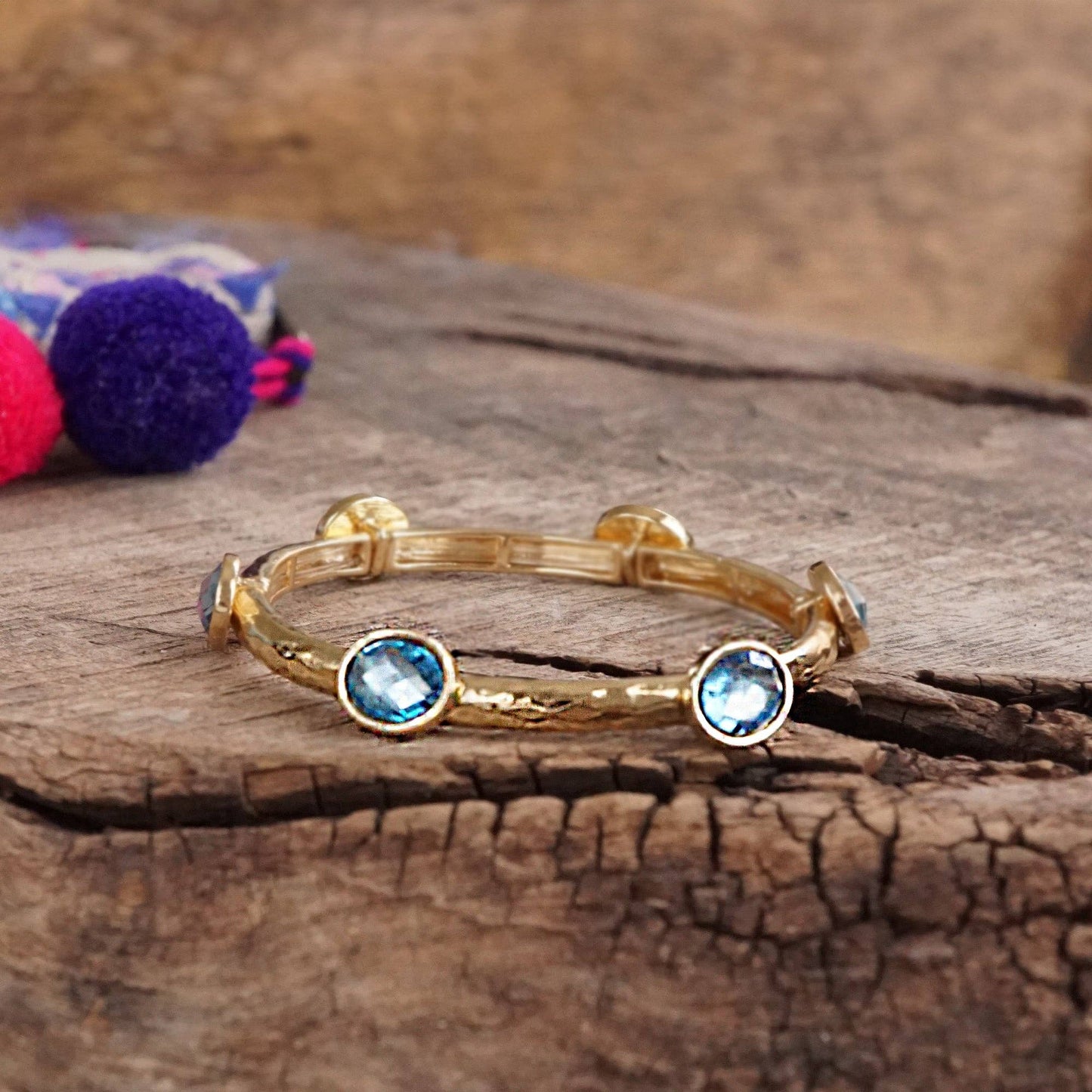 Jeweled Golden Bangle - with Faceted glass oval colorful jewels: Clear - Silver tone bangle