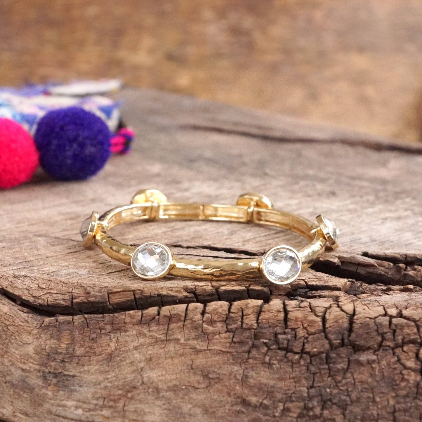 Jeweled Golden Bangle - with Faceted glass oval colorful jewels: Clear - Silver tone bangle