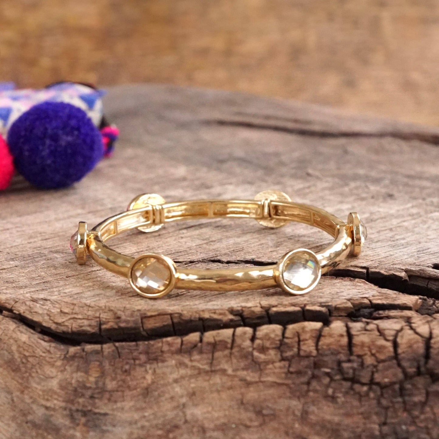 Jeweled Golden Bangle - with Faceted glass oval colorful jewels: Clear - Silver tone bangle