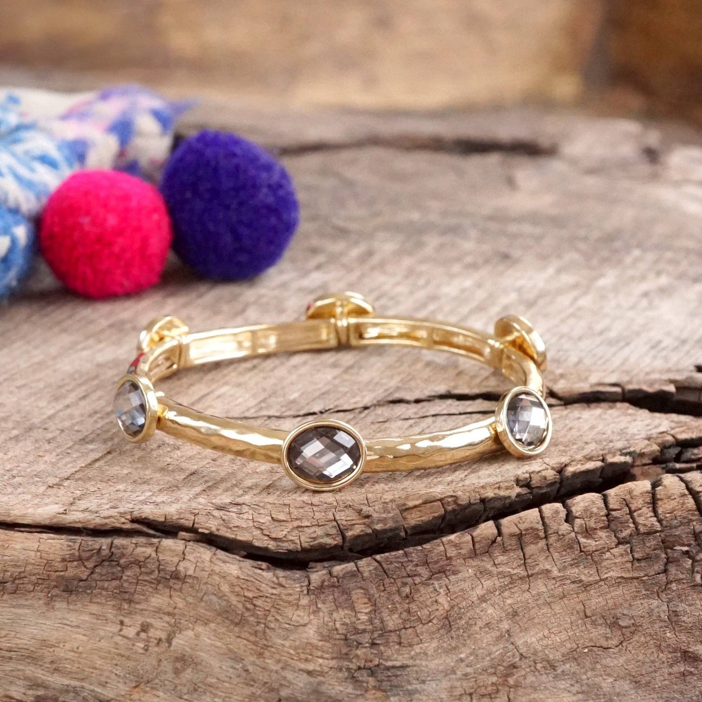 Jeweled Golden Bangle - with Faceted glass oval colorful jewels: Clear - Silver tone bangle
